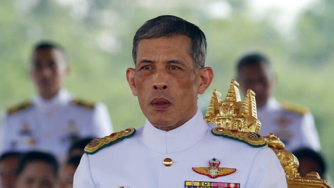 Thailand's Crown Prince Maha Vajiralongkorn watches the annual Royal Ploughing Ceremony in central Bangkok, Thailand, May 13, 2015. The ancient ploughing ceremony in Buddhist Thailand, overseen by Thailand's Crown Prince Maha Vajiralongkorn, marks the end of the dry season and is meant to herald an auspicious start for the rice-planting season.  REUTERS/Chaiwat Subprasom