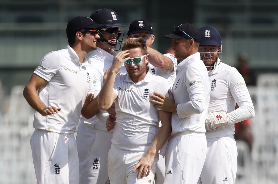 England's Liam Dawson, center, and and his teammates celebrate the dismissal of India's Murali Vijay during their fourth day of the fifth cricket test match in Chennai, India, Monday, Dec. 19, 2016. (AP Photo/Tsering Topgyal)