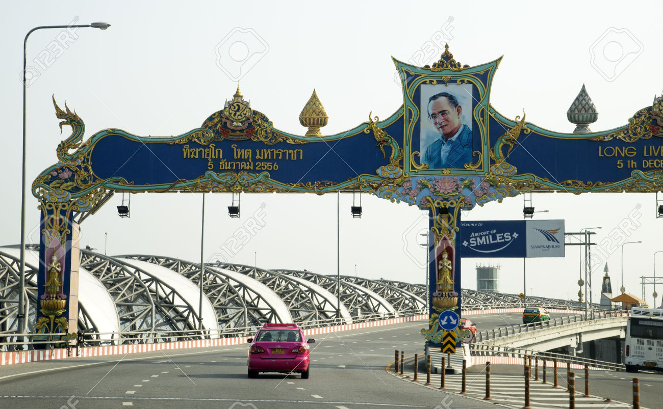 King Bhumibols portrait above airport road at Suvarnabhumi International Airport Bangkok Thailand