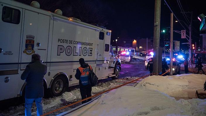 Canadian police officers respond to a shooting in a mosque at the Québec City Islamic cultural center on Sainte-Foy Street in Quebec city on January 29, 2017. Two arrests have been made after five people were reportedly shot dead in an attack on a mosque in Québec City, Canada. / AFP / Alice Chiche (Photo credit should read ALICE CHICHE/AFP/Getty Images)
